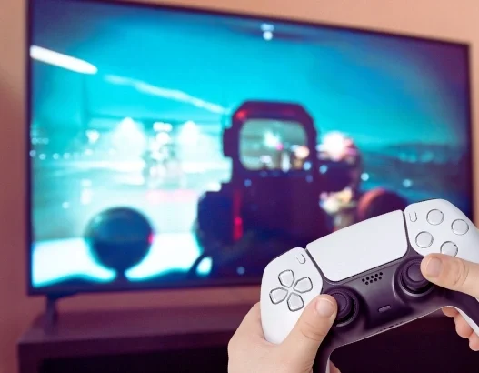 A PlayStation user playing a physical game